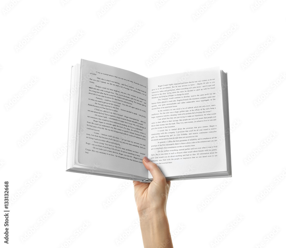 Naklejka premium Female hand holding opened book on white background