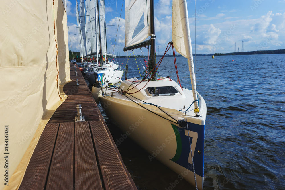 Fototapeta premium Sailing regatta. Summer vacation on the beach.
