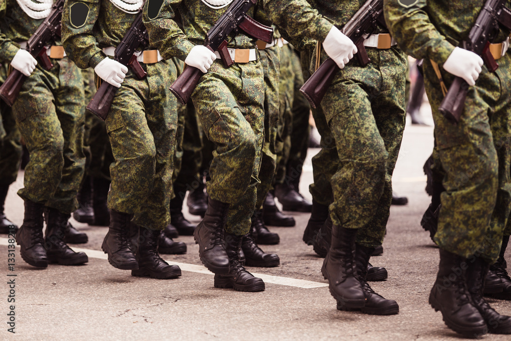 military men in green dress uniform marching to victory parade