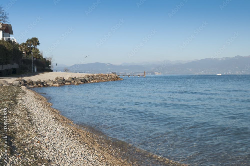 View of the Garda Lake beach during winter, from Peschiera del G