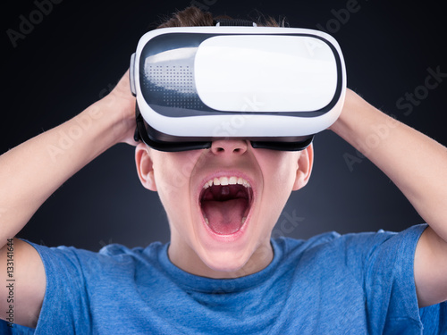Teen boy in VR glasses