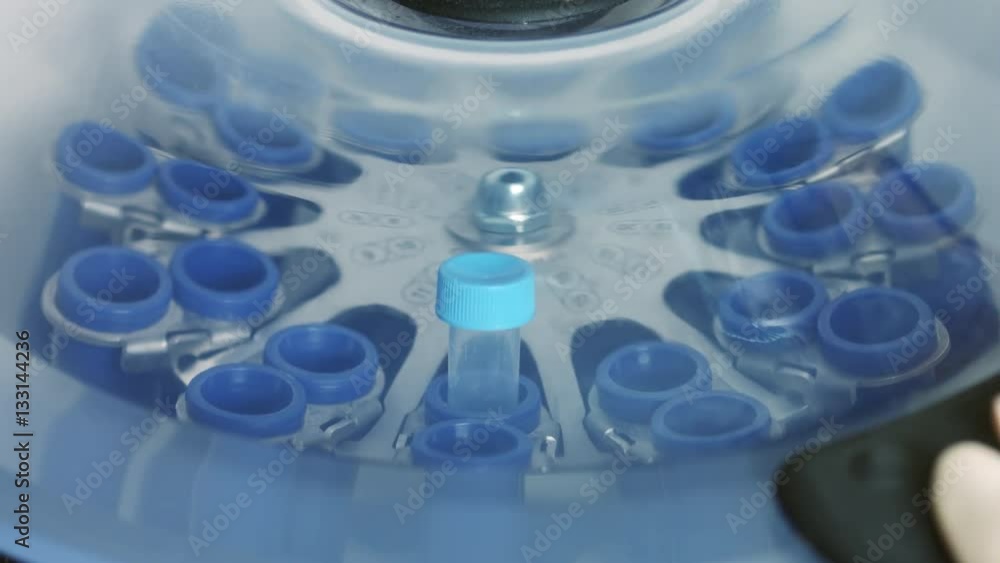 Centrifugation of test tube with sample in laboratory centrifuge Centrifugation of test tube with sample in laboratory centrifuge