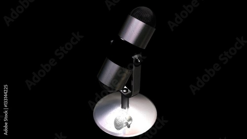 3D studio microphone rotating on a seamless display with alpha channel
