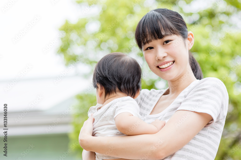 portrait of asian baby and mother relaxing