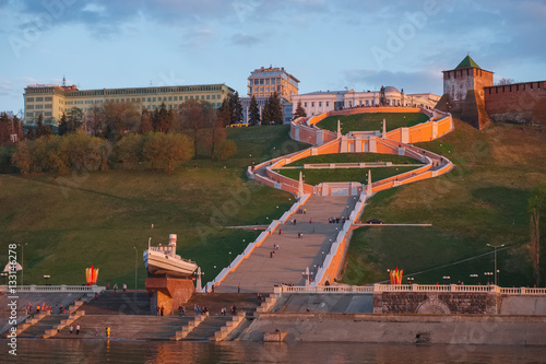 Nizhny Novgorod. Chkalov staircase military boat "Hero" and the Kremlin - the view from the Volga May evening at sunset