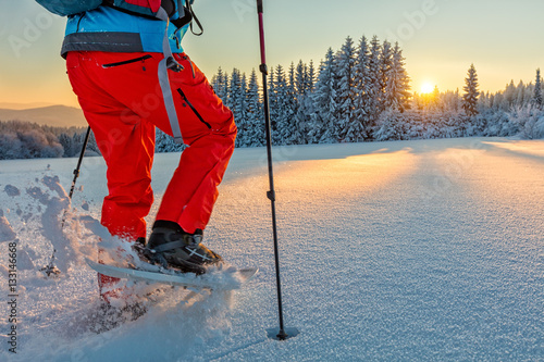 Detail of snowshoe walker in mountains photo