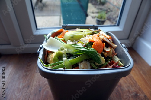Indoor container of domestic food waste, ready to be tipped into