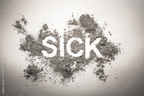 Word sick made in pile of ash, dust, dirt