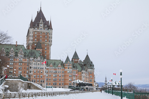 View of Frontenac Castel (Chateau de Frontenac, in French) in winter under the snow. The Château Frontenac is a grand hotel in Quebec City, Quebec, Canada, and a symbol of the city