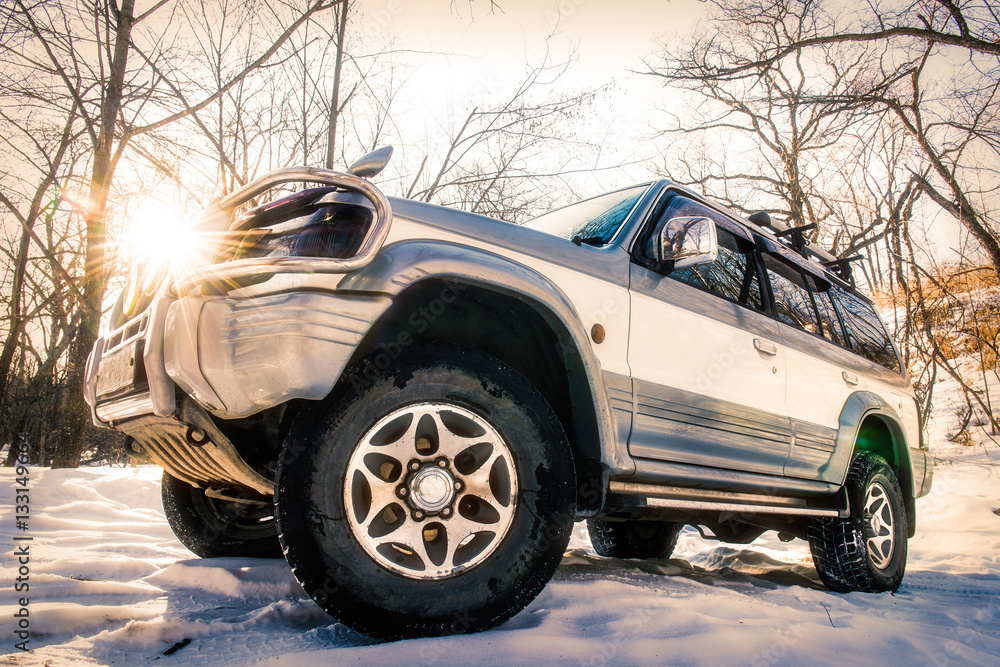 Off road car deep in the winter and snow forest Off road car deep in the winter and snow forest
