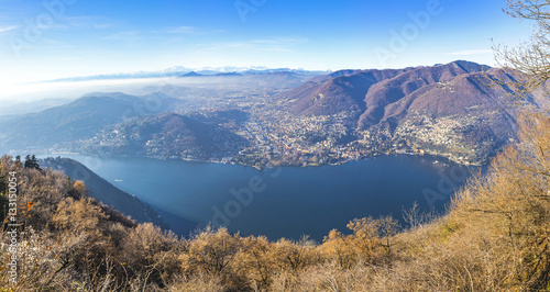 Panoramic view of Como lake in late autumn, Italy. Cernobbio city and Swiss Alps on the background