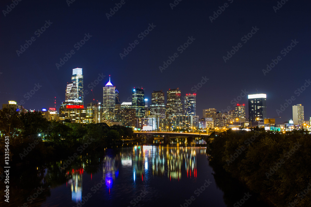 A long exposure of the Philadelphia skyline, with light reflecting on the river