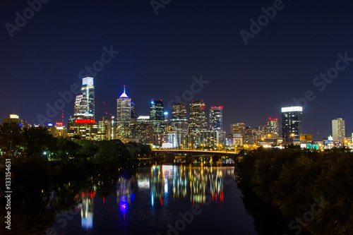 A long exposure of the Philadelphia skyline  with light reflecting on the river