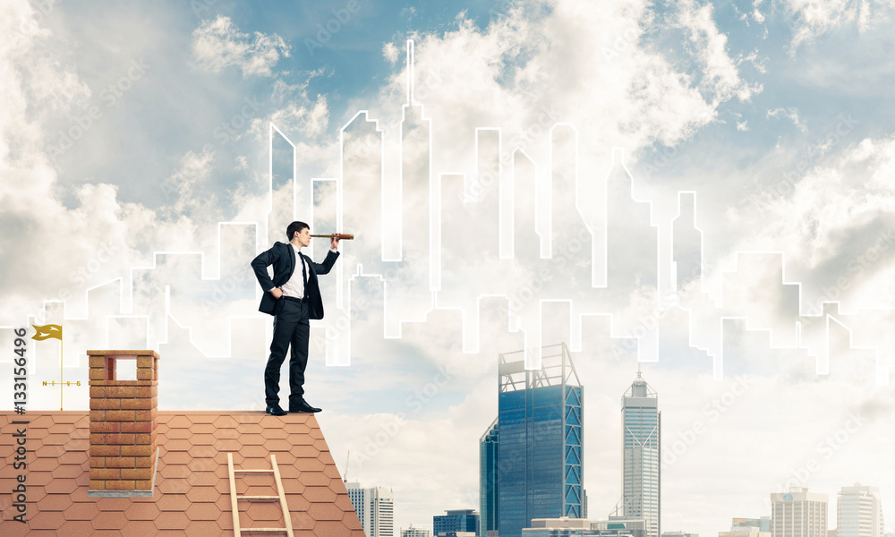 Engineer man standing on roof and looking in spyglass. Mixed med Engineer man standing on roof and looking in spyglass. Mixed med