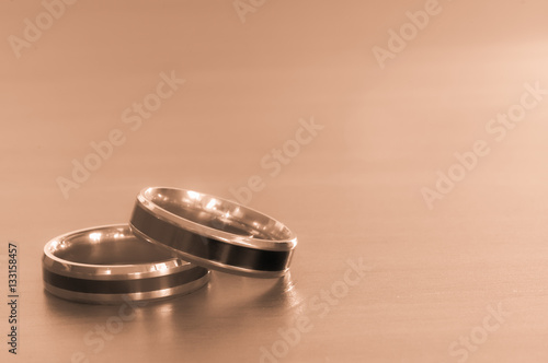 Two rings on the table for valentine day,Sepia color