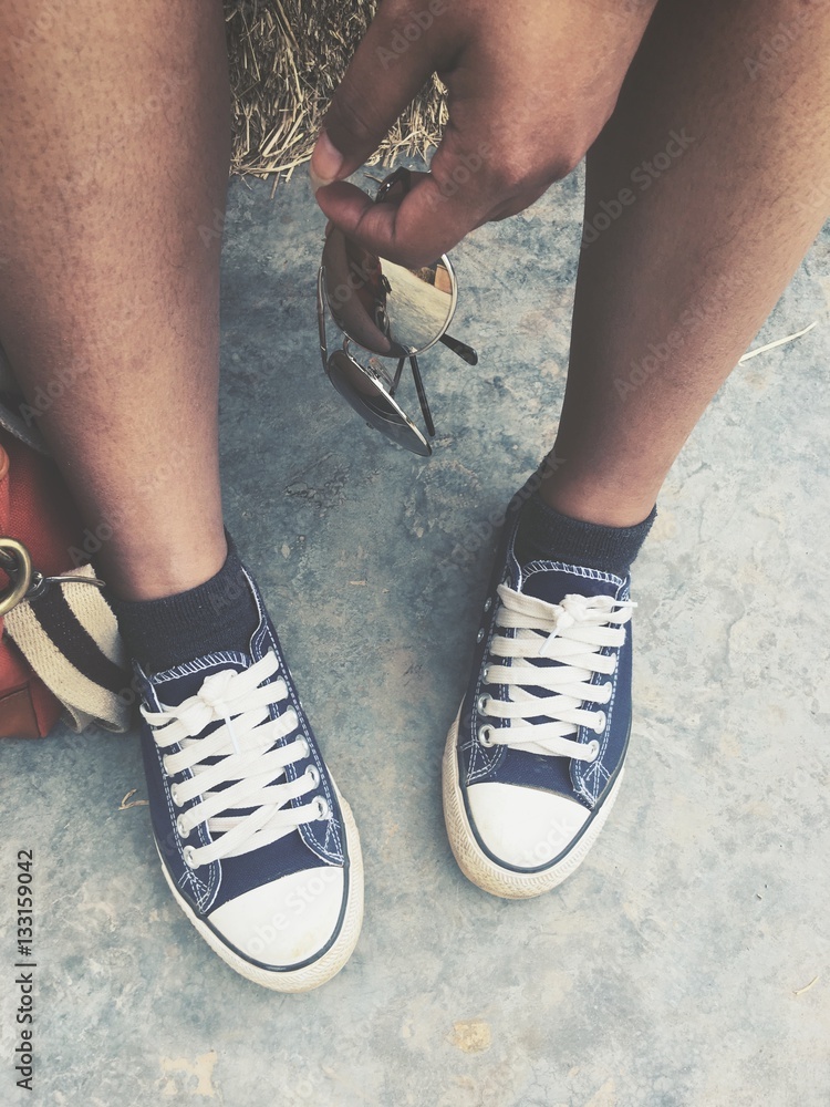 Selfie of sun glasses and bag with shoes