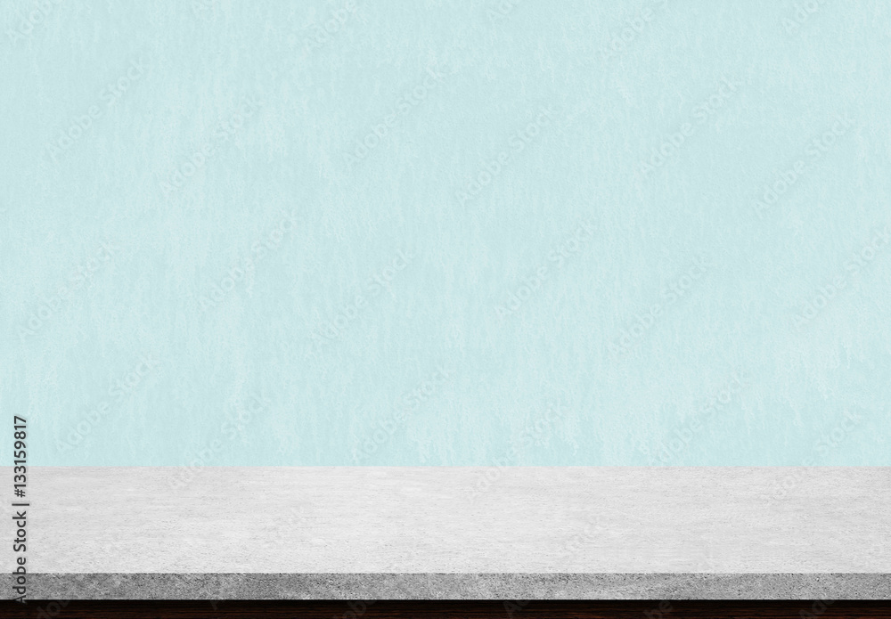 Empty stone table top on blue concrete background, Used for display or montage your products. Empty stone table top on blue concrete background, Used for display or montage your products.