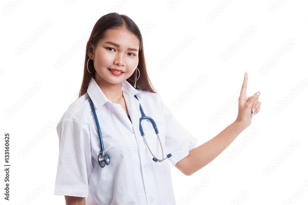 Asian young female doctor point to blank space. Asian young female doctor point to blank space.