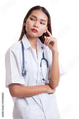 Portrait of Asian young female doctor thinking.