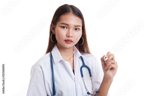 Young Asian female doctor with a red marker.