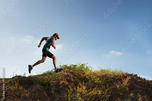 Male Runner of Trail. He was running fast on the mountain