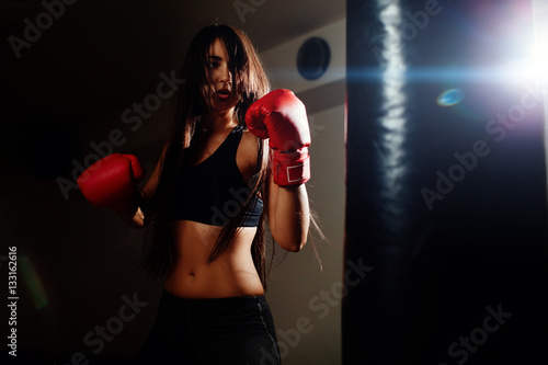 sexy fighter girl punching actively