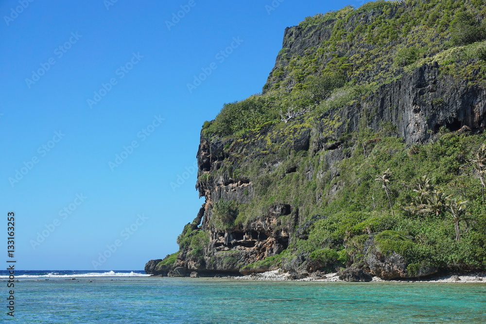 Coastal landscape, eroded limestone cliff with caverns on the shore of the island of Rurutu, French Polynesia, south Pacific ocean, Austral archipelago

