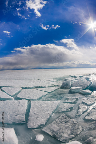 The ice cracks and hummocks on the ice of Lake Baikal from Olkho photo