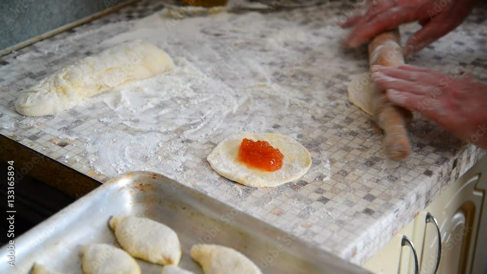 woman prepares pies with jam woman prepares pies with jam