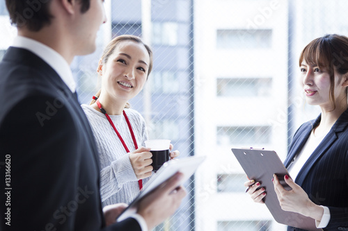 Wallpaper Mural Businessmen are taking a break at the window side of the office Torontodigital.ca