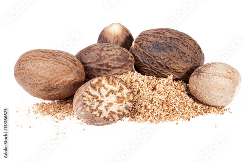 Nutmeg ,  half and ground on white background, close up