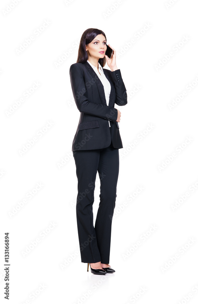 Young businesswoman with a smartphone on white Young businesswoman with a smartphone on white