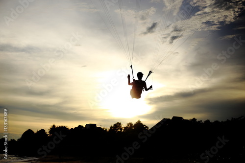 parachute silhouette and sunset 