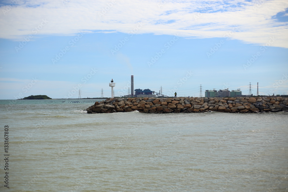 Rock breakwater and Blue sky in Rayong at Thailand