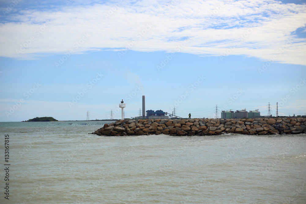 Rock breakwater and Blue sky in Rayong at Thailand