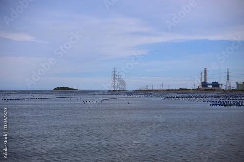 High voltage power pole in the sea at Rayong, Thailand