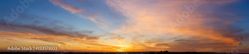 Obraz  z motywem Beautiful sunset sky with amazing colorful clouds against deep blue