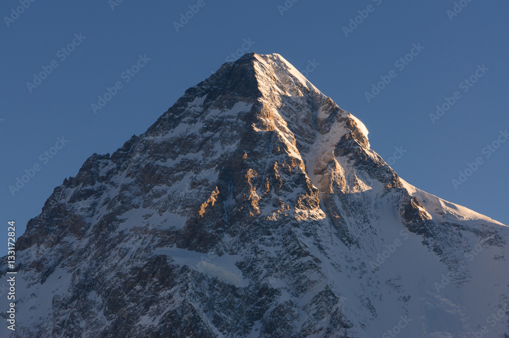 Fototapeta premium Sunlight on top of K2 mountain peak in a morning, K2 trek, Pakis