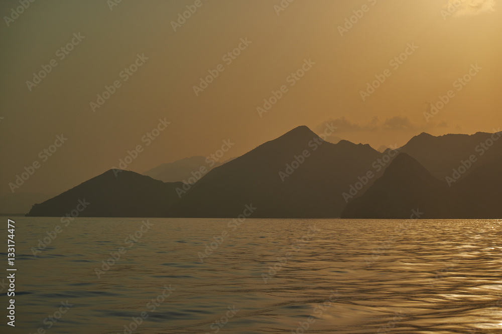 Oman sunset sea mountains