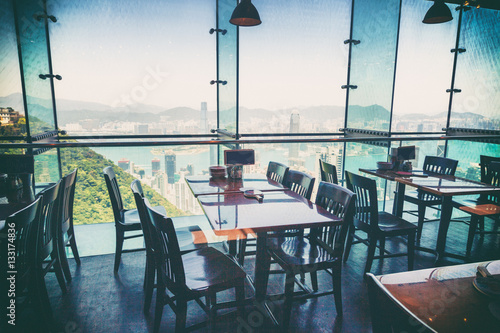 Restaurant with views of the big city with skyscrapers. Hong Kon