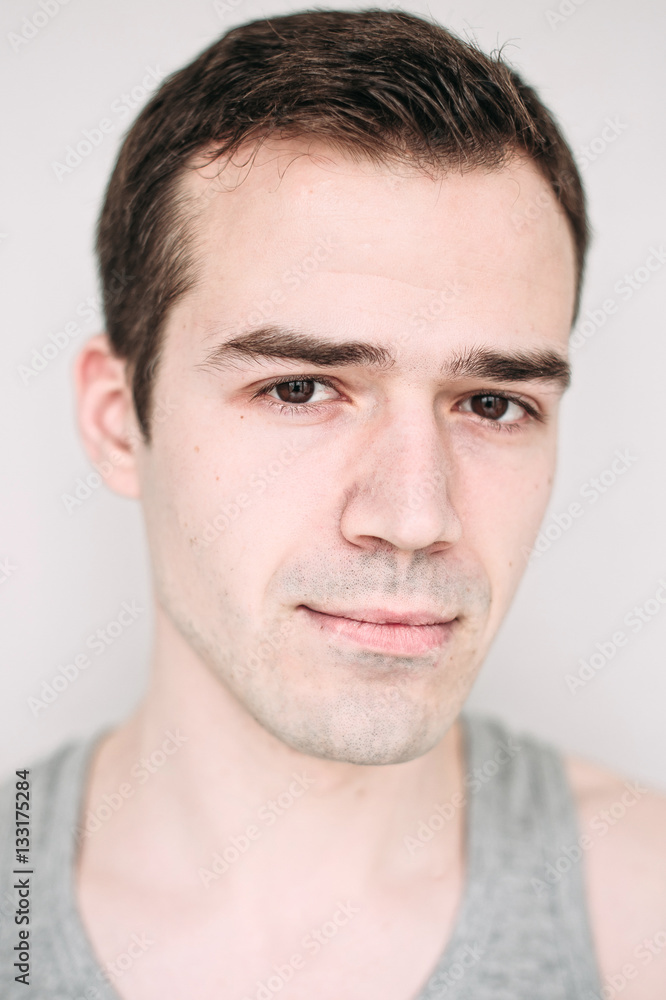 Close up portrait of a handsome young man on white Close up portrait of a handsome young man on white