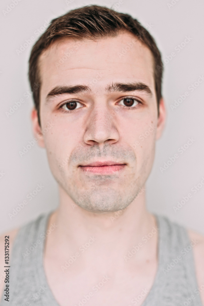 Close up portrait of a handsome young man on white Close up portrait of a handsome young man on white
