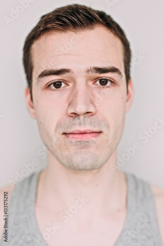 Close up portrait of a handsome young man on white