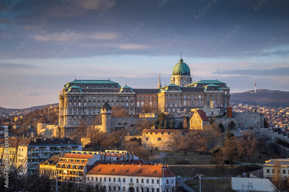 Budapest, Hungary - The famous Buda Castle (Royal Palace), St. Matthias Church and Fishermen's Bastion at sunset on a nice winter afternoon taken from Gellert Hill
