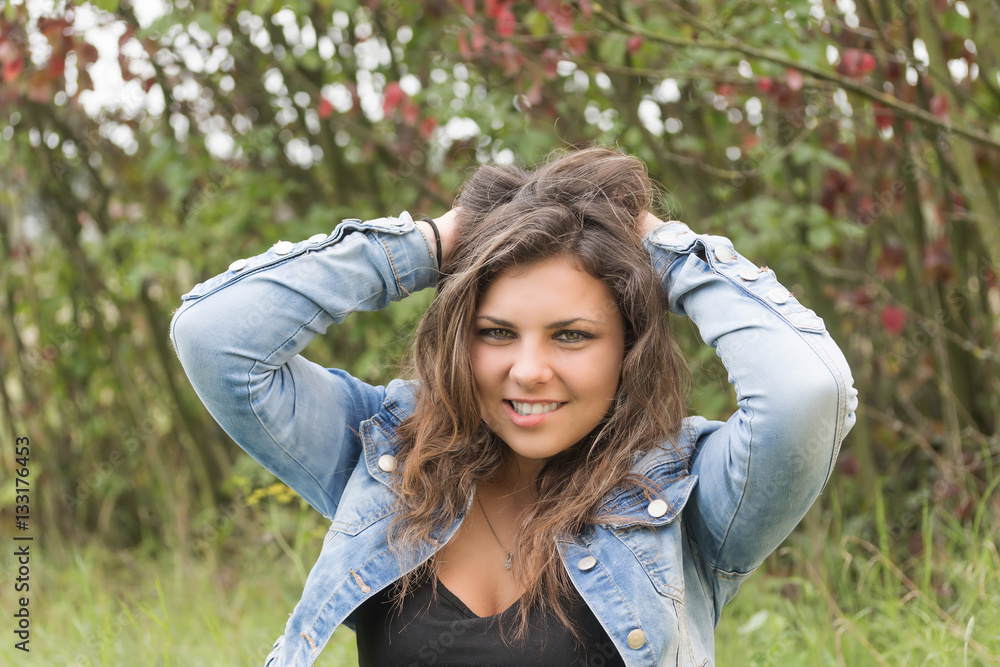 Cool smiling teenage girl outdoors