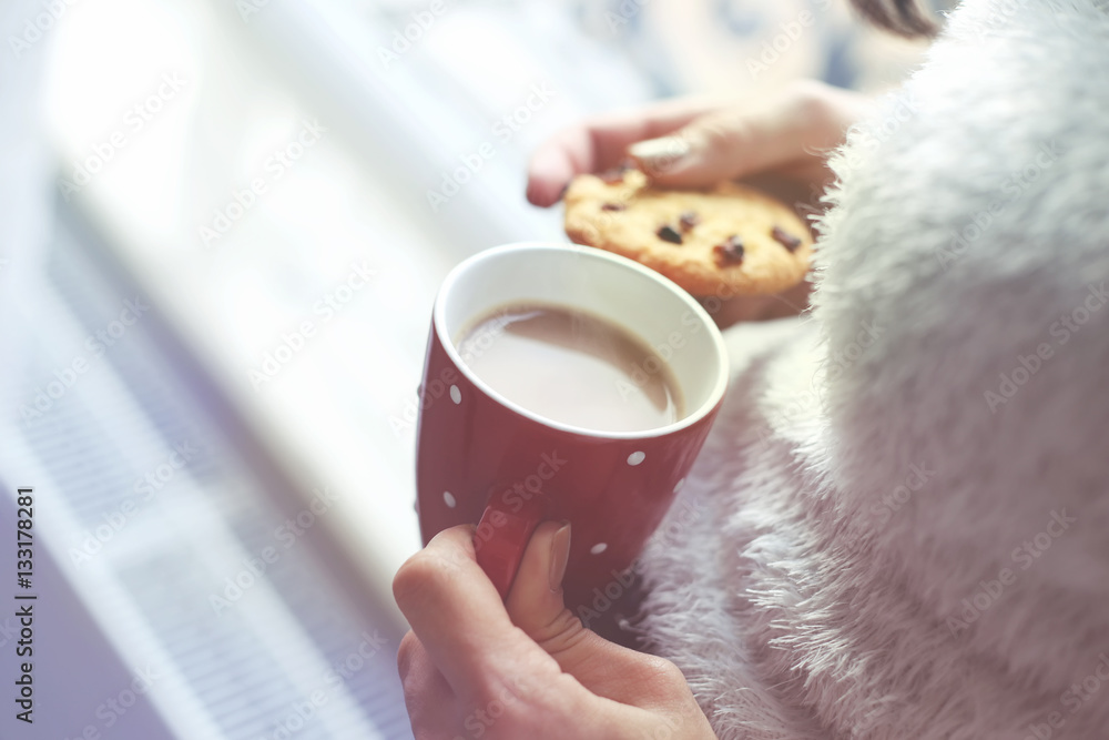 Woman with coffee cup and tasty cookie Woman with coffee cup and tasty cookie