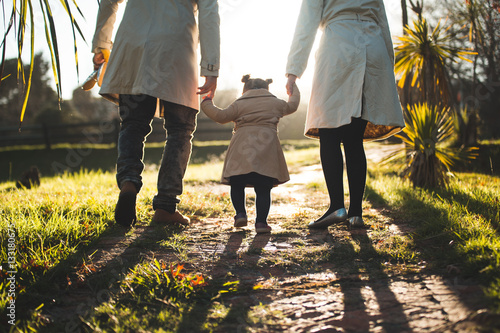 Parents walking with child