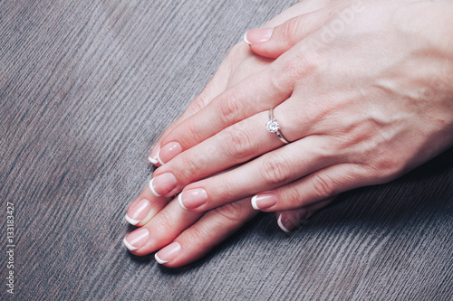 Beautiful female hands with french manicure n