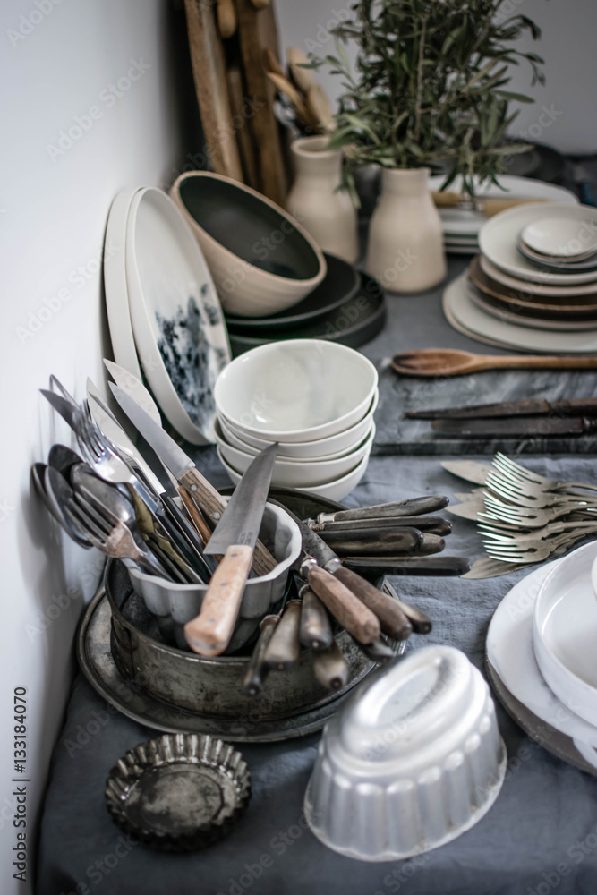 Utensils and dishes on table Utensils and dishes on table