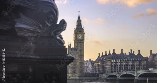 Dolly selective focus revealing time lapse view of the House of Parliament and the Big Ben in London at sunset